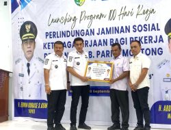 “Pelita Perlindungan: Bupati Erwin Burase Menyalakan Harapan bagi Pekerja Rentan”